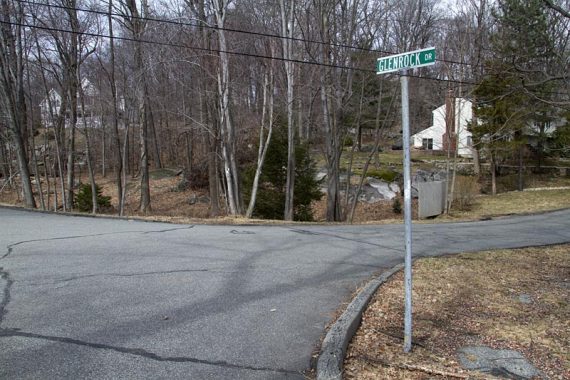 The WHITE trail heads through several streets in a neighborhood