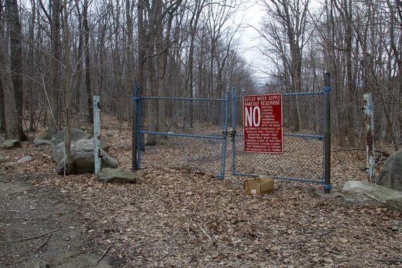 Reservoir fence; BLUE markers on post