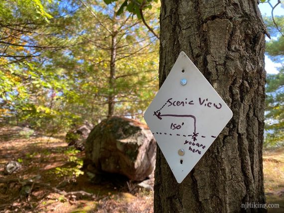 White diamond marker for scenic view side trail
