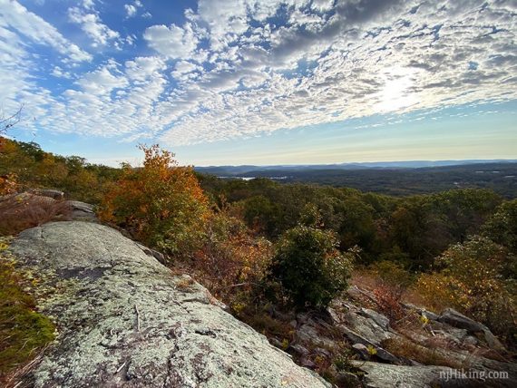 Rocky outcrop with a wide view across a forest.