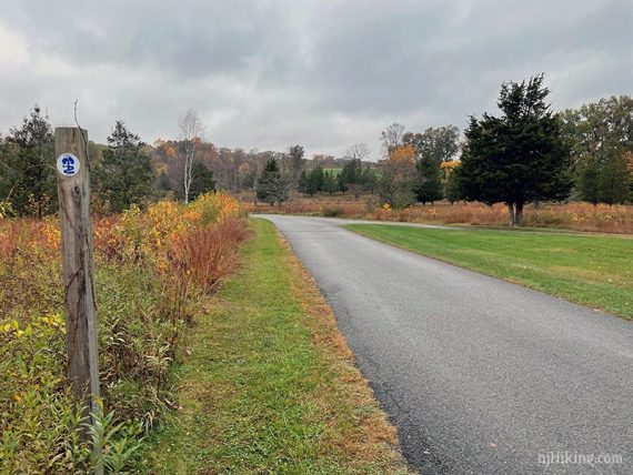 Patriots Path marker next to paved road to Kay's Center.