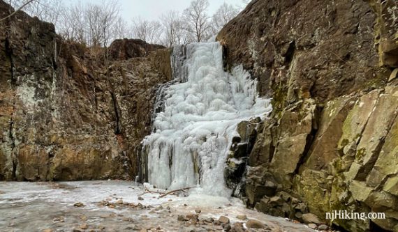 Frozen waterfall over a cliff