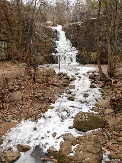 Hemlock Falls with a brook in the foreground.
