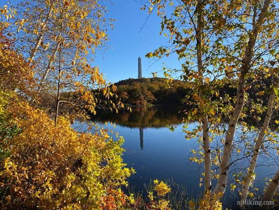 High Point Monument framed with trees and Lake Marcia.