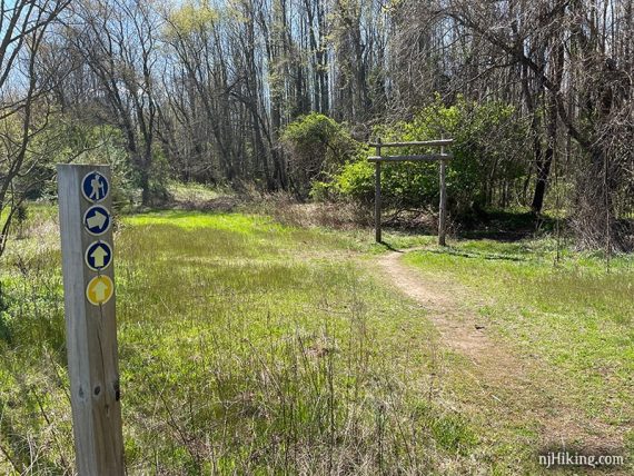 Path with trail marker and arch