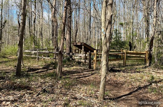 Fence and wooden cover over a gravesite