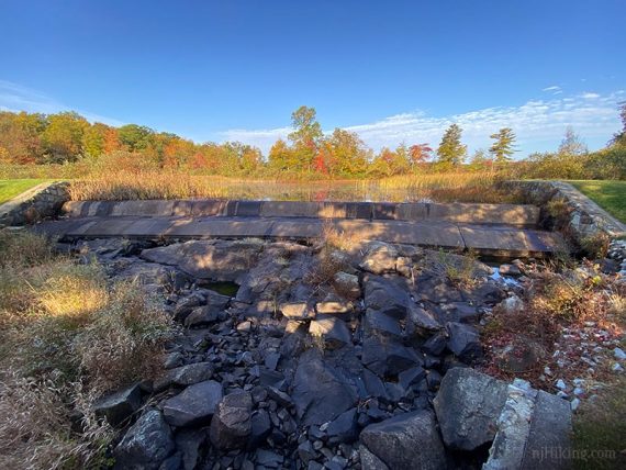 Water flowing over rocks on a stone spillway.