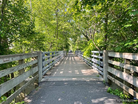 Fence along a paved rail trail