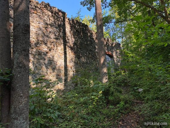 Path to large stone wall.