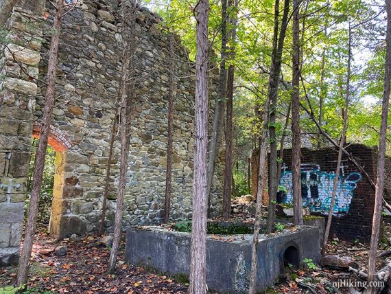 Stone buildings with graffiti.