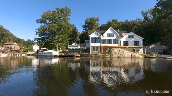 Large lakeside house seen from a kayak