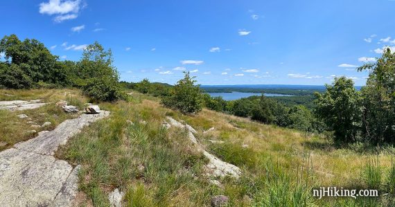 Rocky outcrop on the Appalachian Trail with a lake in the distance.