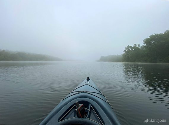 Kayak on a foggy lake.