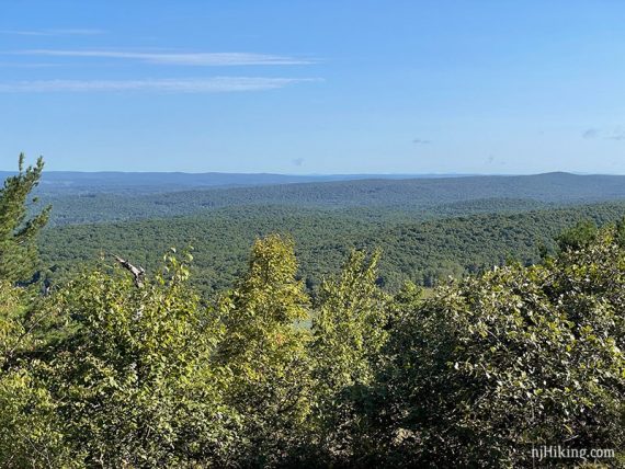 Low green hills seen from a viewpoint.