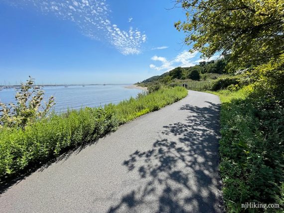 Paved trail curving around a bay