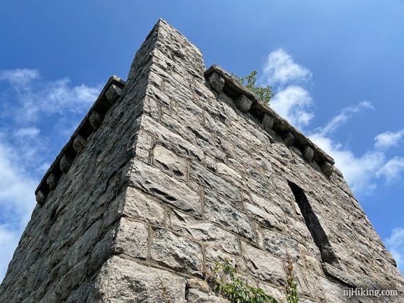 Looking up at a stone water tower