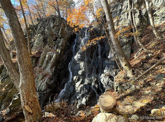 Waterfall tumbling over tall rocks