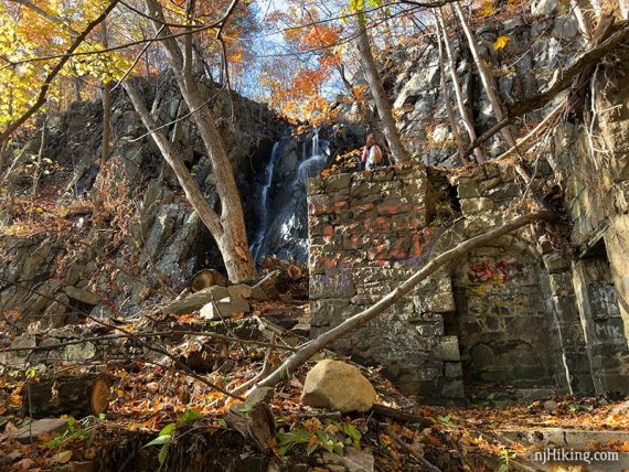 Building ruins near a waterfall.