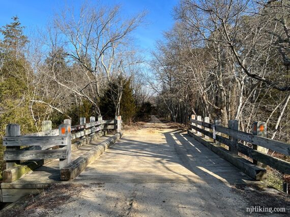 Wooden bridge over creek.