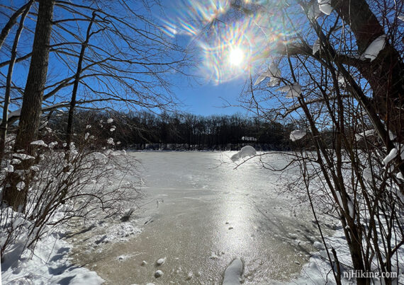 Frozen lake with sun shining