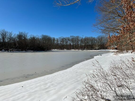 Frozen lake and snowy shore