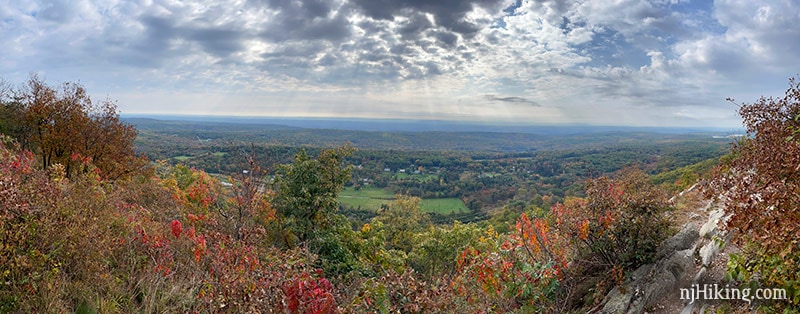 Panoramic view over a valley from a rocky ridge