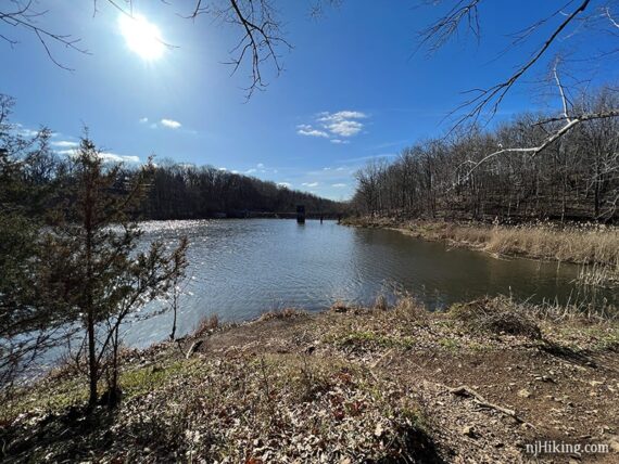 Utility building over a reservoir seen in the distance