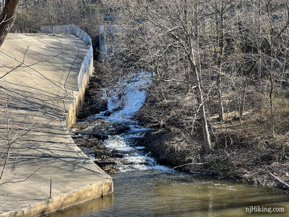 Waterfall next to a concrete dam