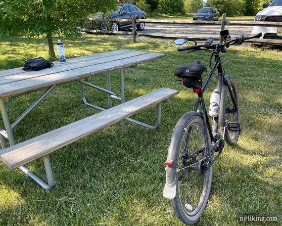 Bike next to a picnic table.