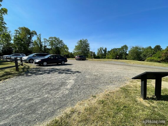 Large gravel parking lot for a rail trail.