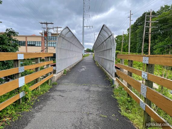 Trail bridge with curved fence up the sides