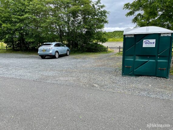 Gravel parking lot and portable toilet for Henry Hudson Trail