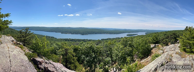 Panoramic view over Greenwood Lake from a rocky ridge