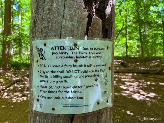 Fairy Trail rule sign posted on a tree.