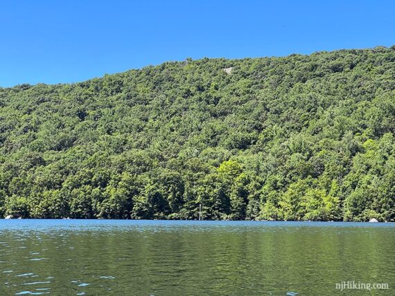 Rocky viewpoint on Horse Pond Mountain seen from a kayak.