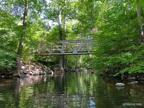 Large trail bridge over a river.