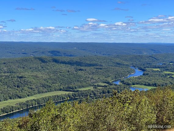 Closer view of the Delaware River snaking through low forested hills.