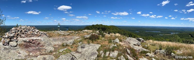 Hiker looking over a panorama from Raccoon Ridge.