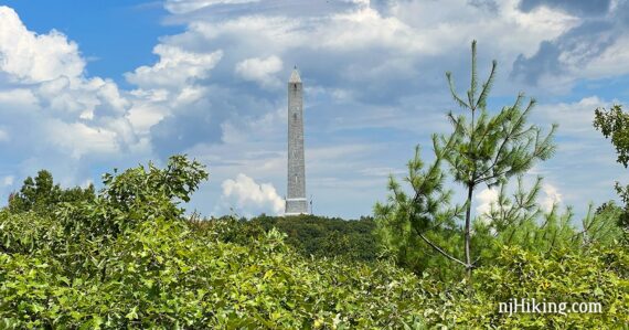 High Point Monument on a green forested hill.