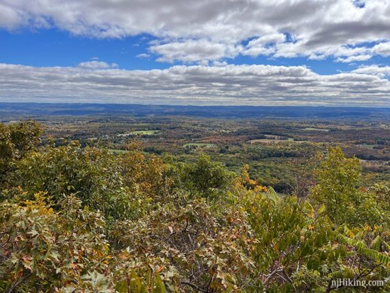 Blue skies and fluffy clouds over the valley below Sunrise Mountain.