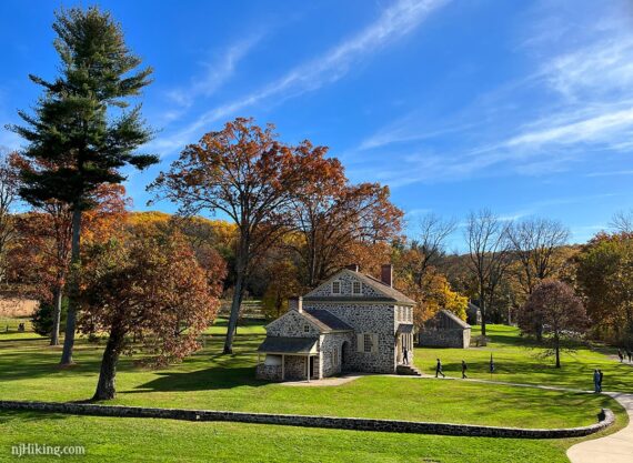 Fall foliage around a stone house used by Washington at Valley Forge.