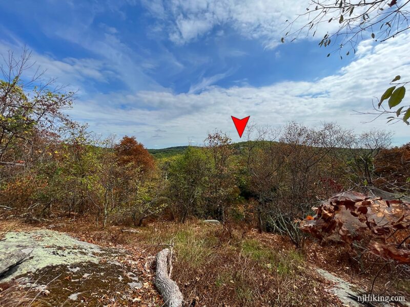 Arrow marking the location of cliffs seen from a viewpoint.