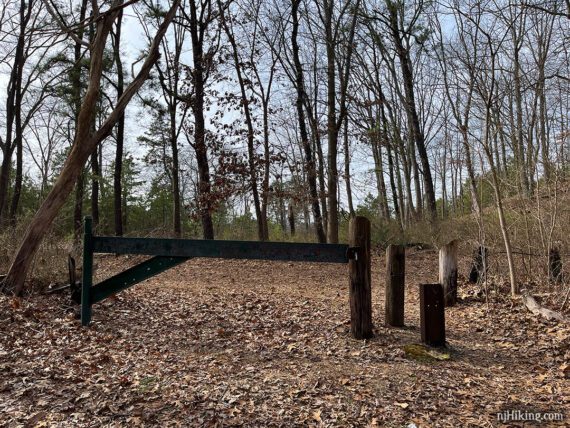 Large park gate at the intersection of two woods roads.