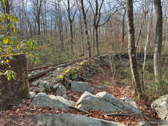 Trail on a raised berm with a pipeline on top.