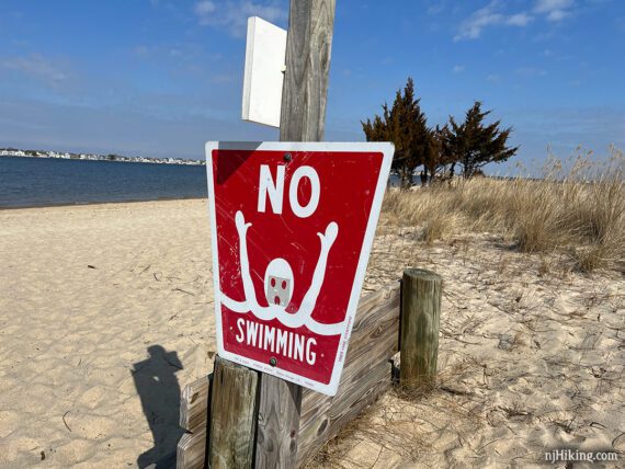 Large red NO SWIMMING sign copyright 1969 Anne Stentiford. 