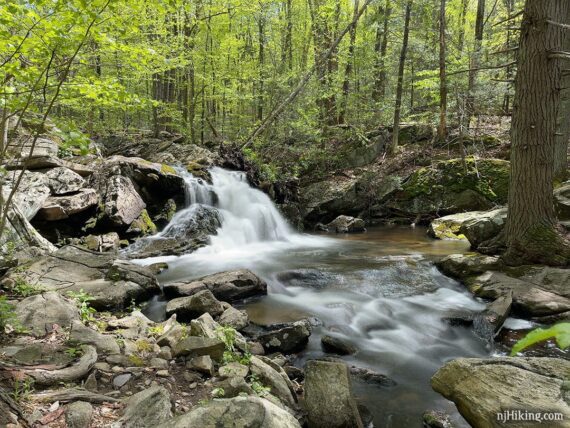 Apshawa Falls surrounded by rocks.