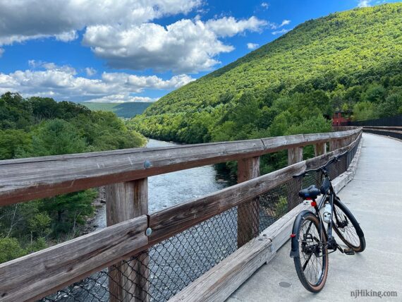 Bike on a bridge with a view of the Lehigh River.