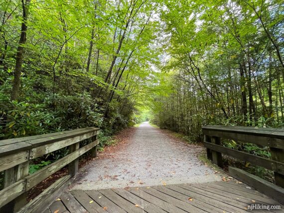 Bike trail going over a wooden bridge.