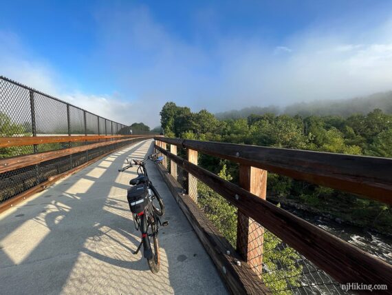 Bike on a concrete bridge over the Lehigh River.