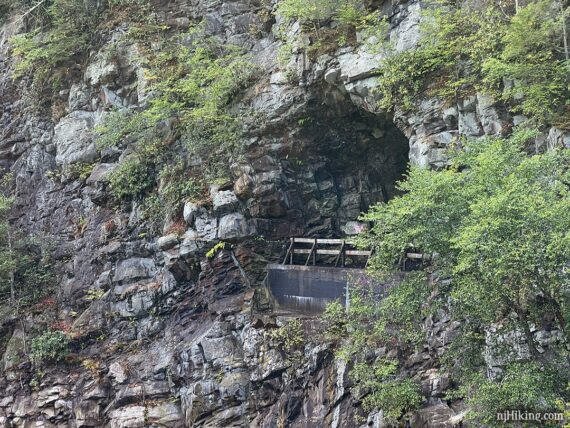 Close up of the Turn Hole Tunnel cut through the side of a mountain.